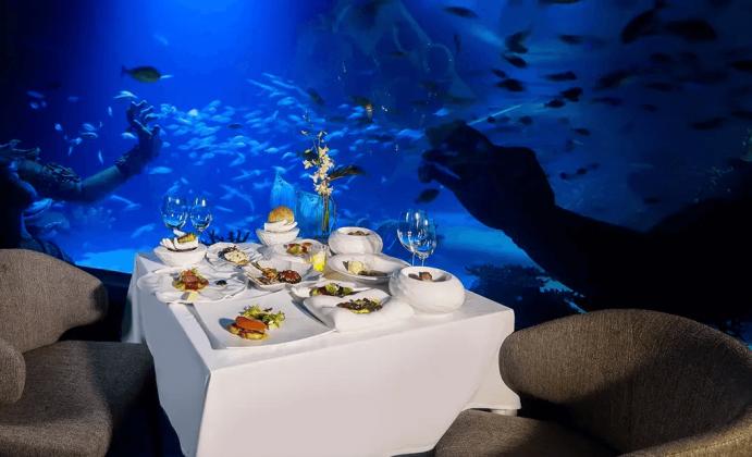 Luxurious restaurant surrounded by aquarium